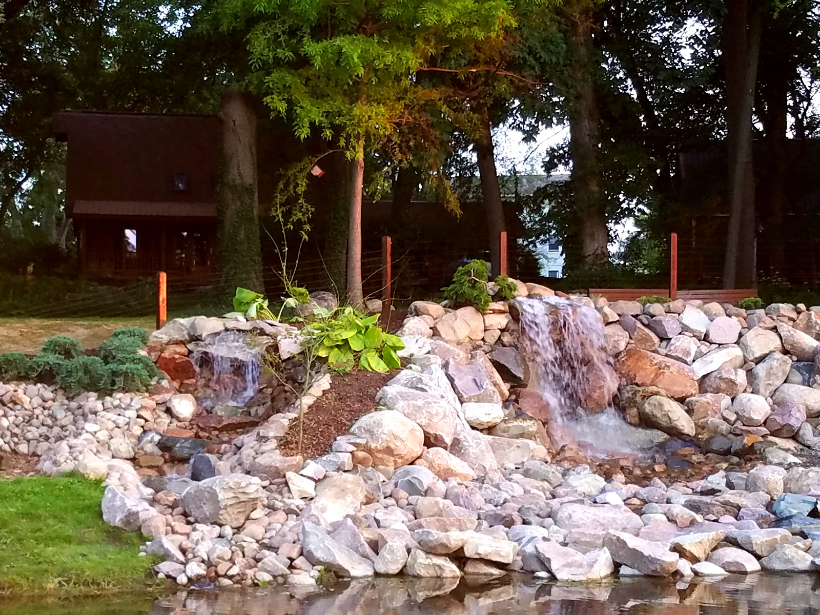 The Waterfall has additional relaxing seating and firepit